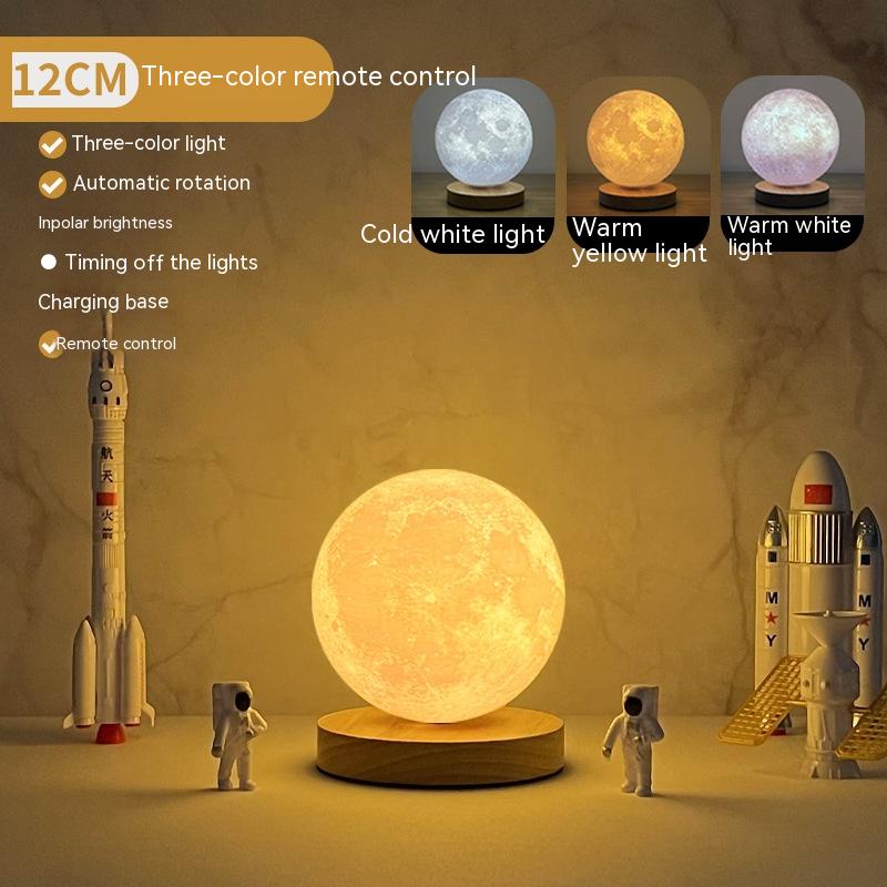 Moon lamp with three-color remote control feature, surrounded by space-themed decorations.